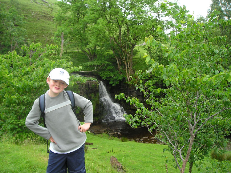 Kieran at waterfall in Keld